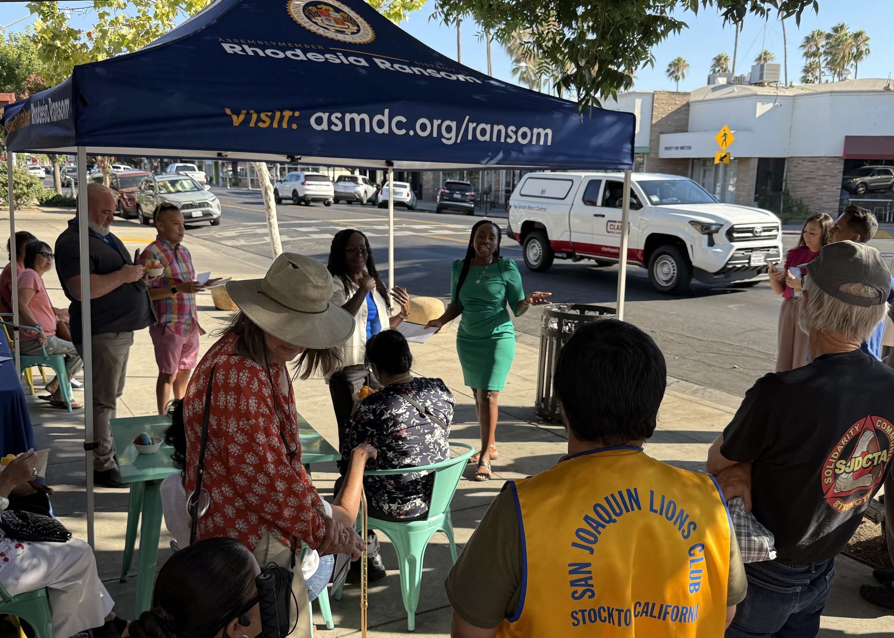 Assemblymember Rhodesia Ransom speaking to a crowd of people at her meet and greet event at Ululani's Hawaiian Shaved Ice located at Stockton's Miracle Mile.