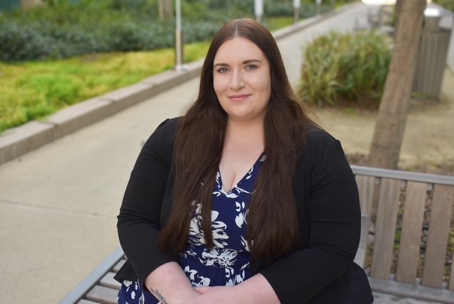 Alexis Wilbur sitting on a bench