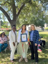 Assemblymember, Rhodesia Ransom, and Stanislaus State President, Britt Rios-Ellis, with graduating student
