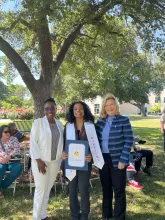 Assemblymember, Rhodesia Ransom, and Stanislaus State President, Britt Rios-Ellis, with graduating student