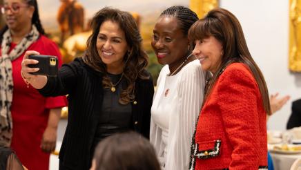 Assemblymember Rhodesia Ransom taking a selfie with event attendees