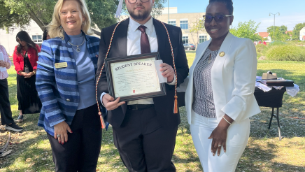 Assemblymember Rhodesia Ransom, and Stanislaus State President, Britt Rios-Ellis, with graduating student