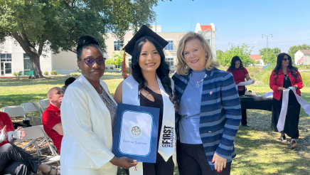 Assemblymember Rhodesia Ransom, and Stanislaus State President, Britt Rios-Ellis, with graduating student