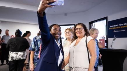 Community member meeting with Assemblymember Rhodesia Ransom during Open House