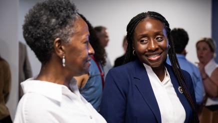Community member meeting with Assemblymember Rhodesia Ransom during Open House