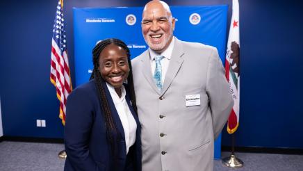 Community member meeting with Assemblymember Rhodesia Ransom during Open House
