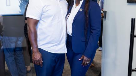 Assemblymember Rhodesia Ransom and her husband standing together during District 13 Open House celebration