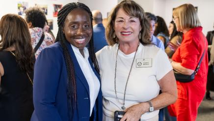 Community member meeting with Assemblymember Rhodesia Ransom during Open House