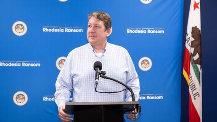 Stockton Chamber of Commerce CEO Timm Quinn speaking at Assemblymember Rhodesia Ransom’s District 13 Open House ceremony in Stockton, California