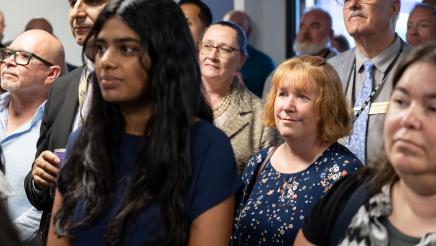 Constituents listening to Assemblymember Rhodesia Ransom give opening remarks at District 13 Open House in Stockton, California
