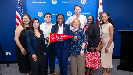 Assemblymember Rhodesia Ransom with Stanislaus State staff and Stan State alumni from her district office team at District 13 Open House in Stockton, California