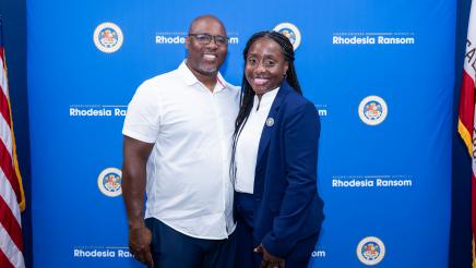 Assemblymember Rhodesia Ransom and her husband standing together during District 13 Open House celebration